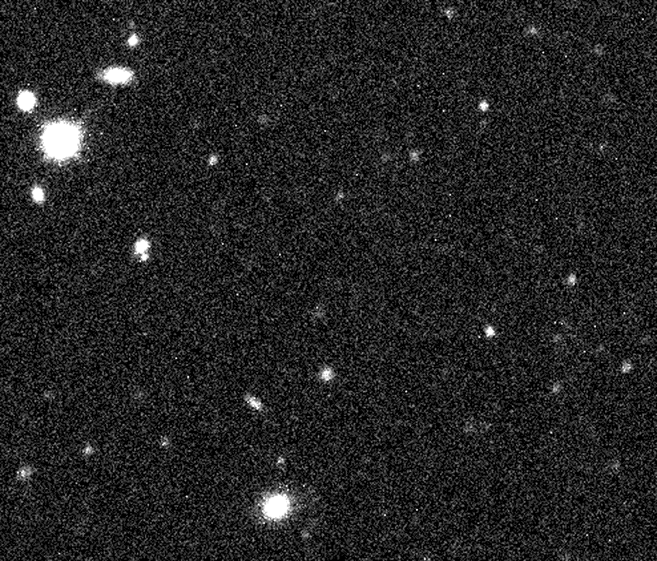 Die Animation zeigt die Entdeckungsbilder des möglichen Zwergplaneten 2012 VP113. Die Bilder sind grau gesprenkelt. Ein Objekt rechts in der Mitte bewegt sich, die anderen hellen Flecke bleiben still stehen.