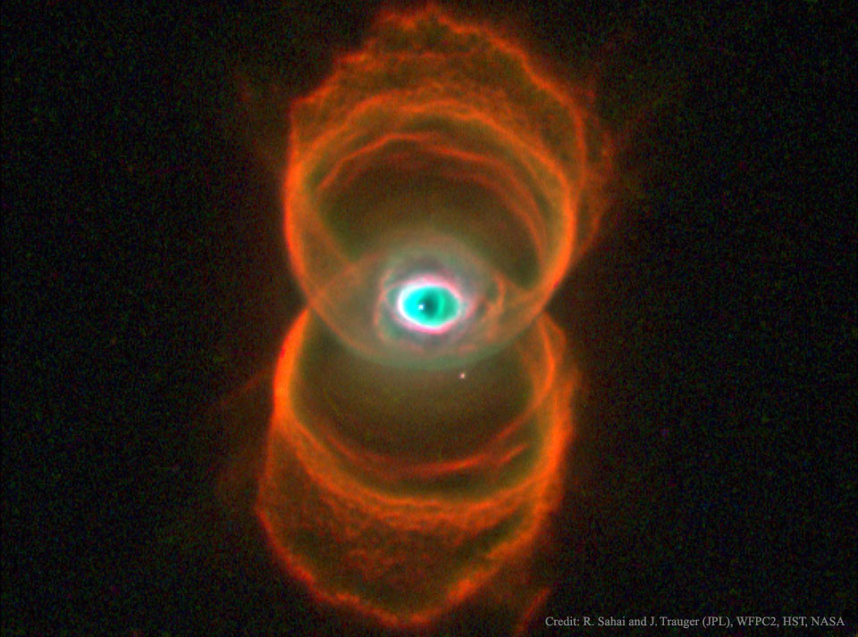 Rote Ringe sind so angeordnet, dass sie an eine Sanduhr erinnern. In der Mitte ist ein Bereich, wo sie sich überschneiden. Dort leuchtet ein grünlicher Nebel, der stark an ein offenes Auge erinnert.